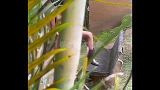 The caretaker spies on his mistress masturbating by the river.