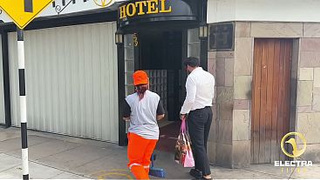 A CHOLONA CLEANING WORKER GETS UP, LIMA-PERU