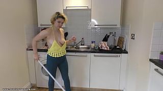 Delilah mops the kitchen floor and gives great downblouse view